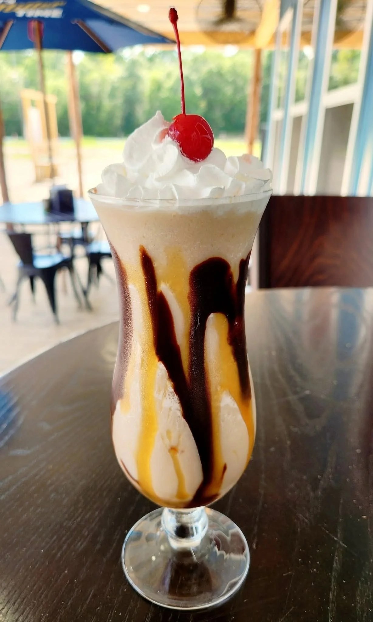 Delicious ice cream sundae with chocolate and caramel drizzle