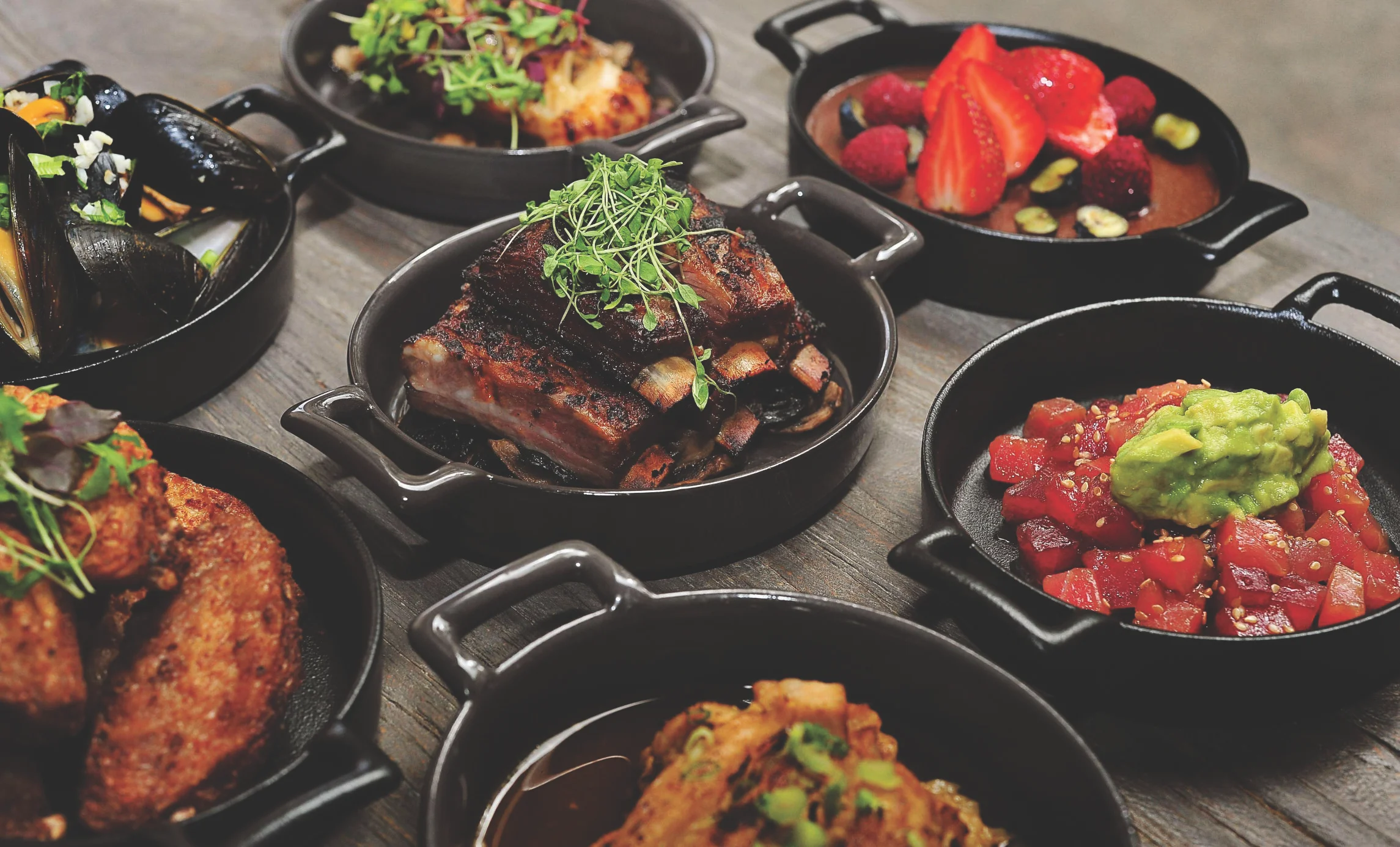Assorted tapas featuring grilled meats and seafood