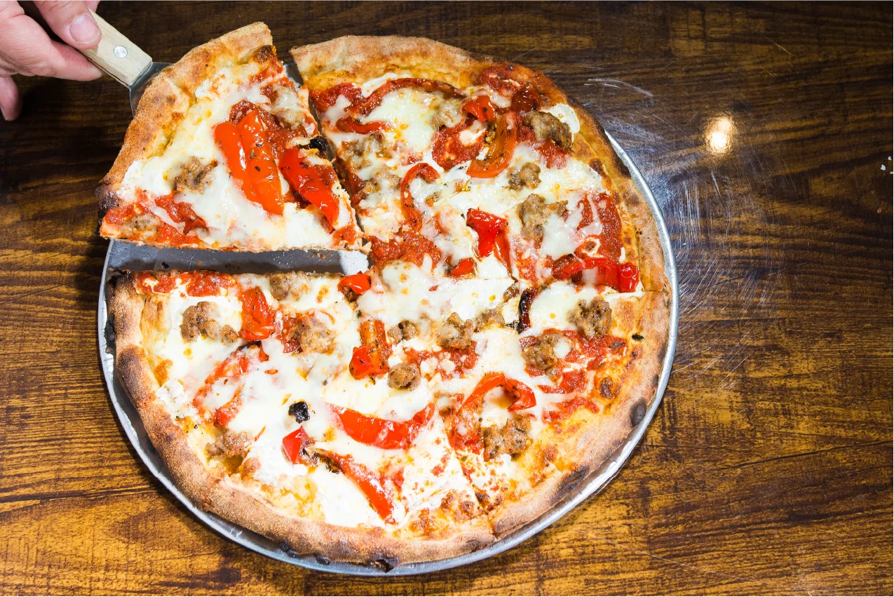 Sicilian-style pizza with sausage and roasted red peppers