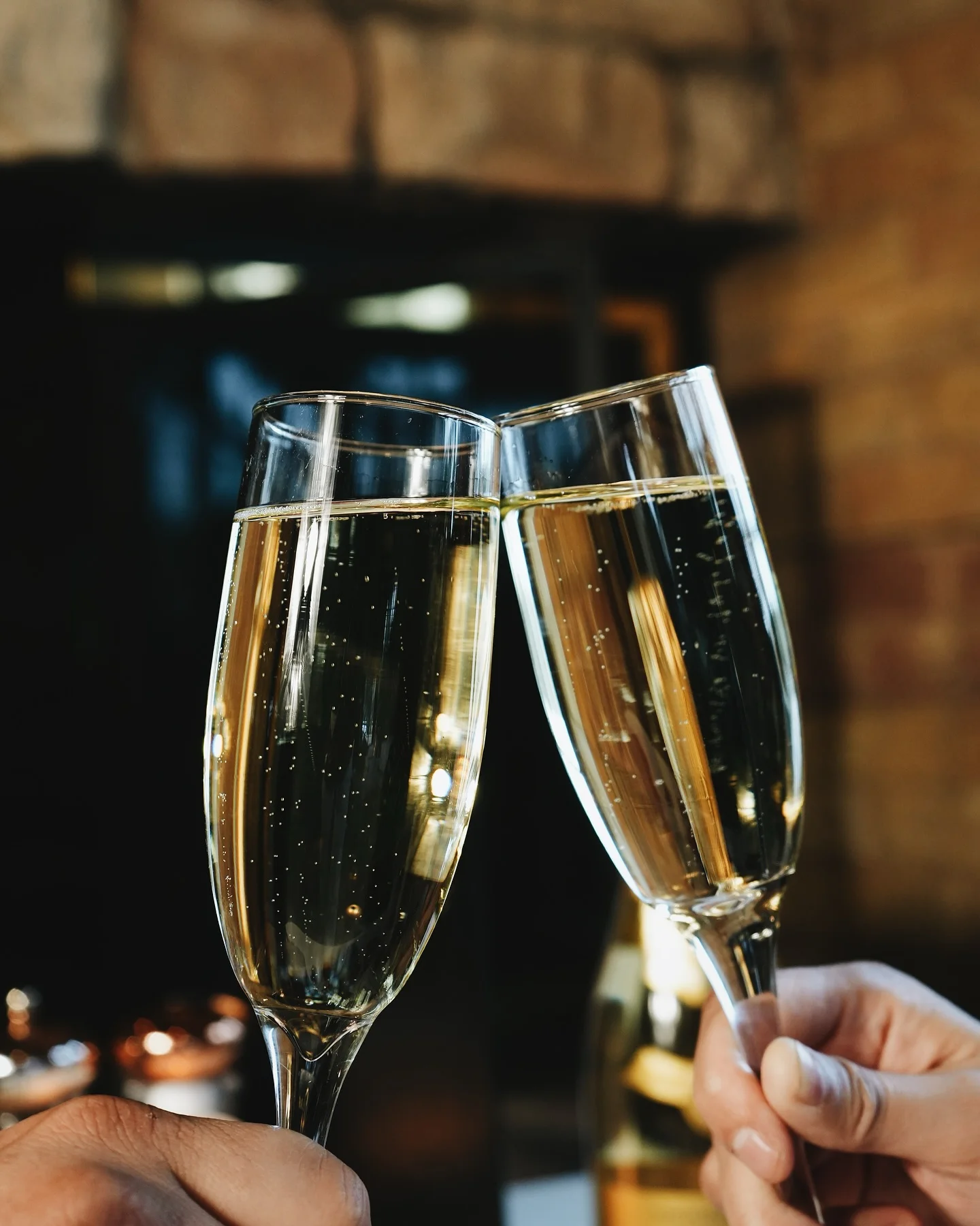 Champagne flutes clinking in celebration