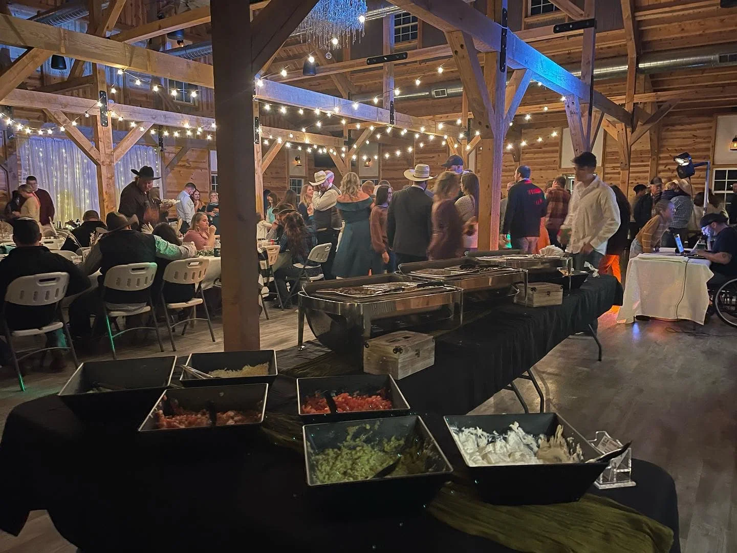 Rustic dining area with buffet setup for a festive event