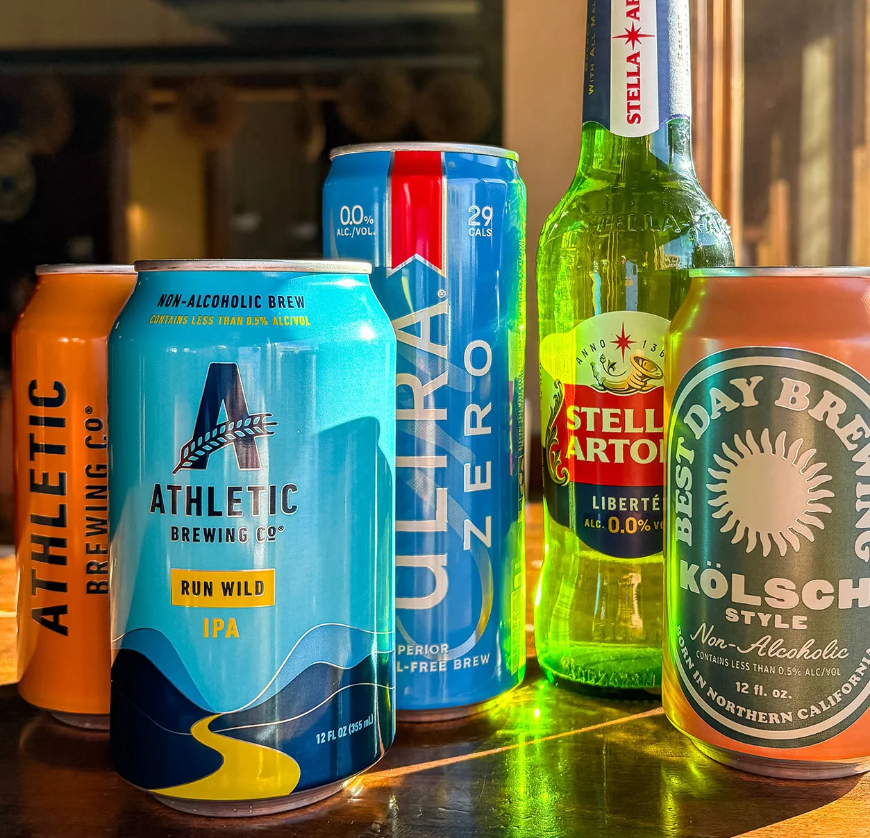 Selection of non-alcoholic beers on a wooden table