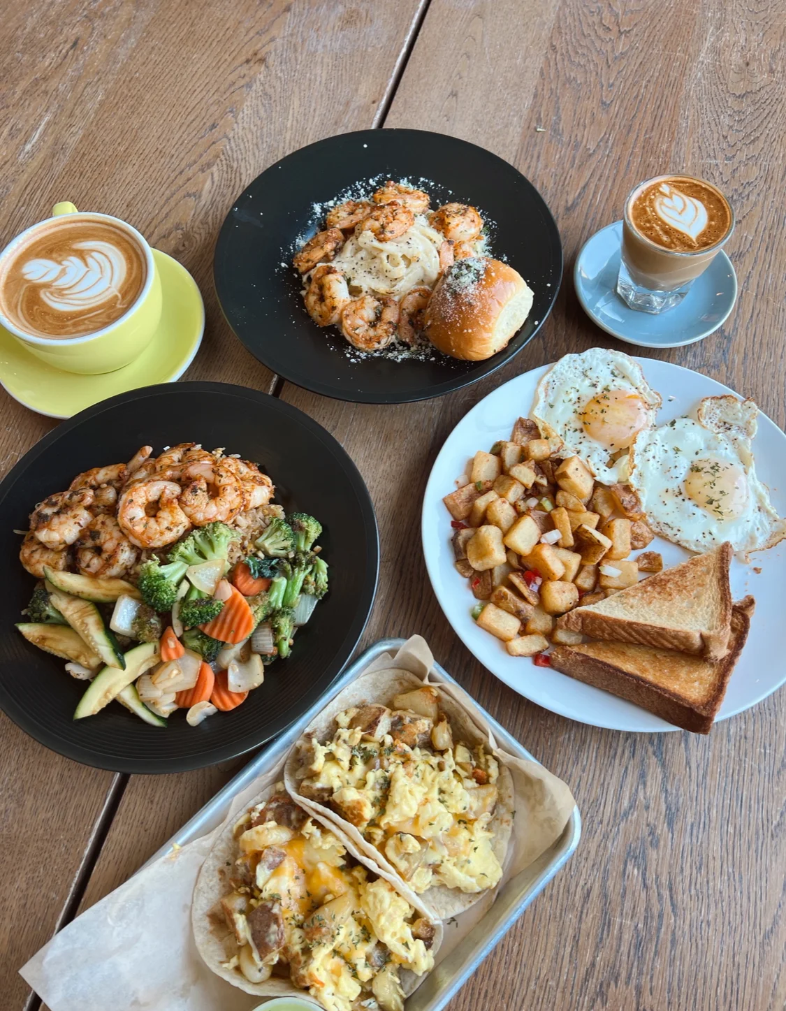Shrimp and eggs breakfast platter with coffee