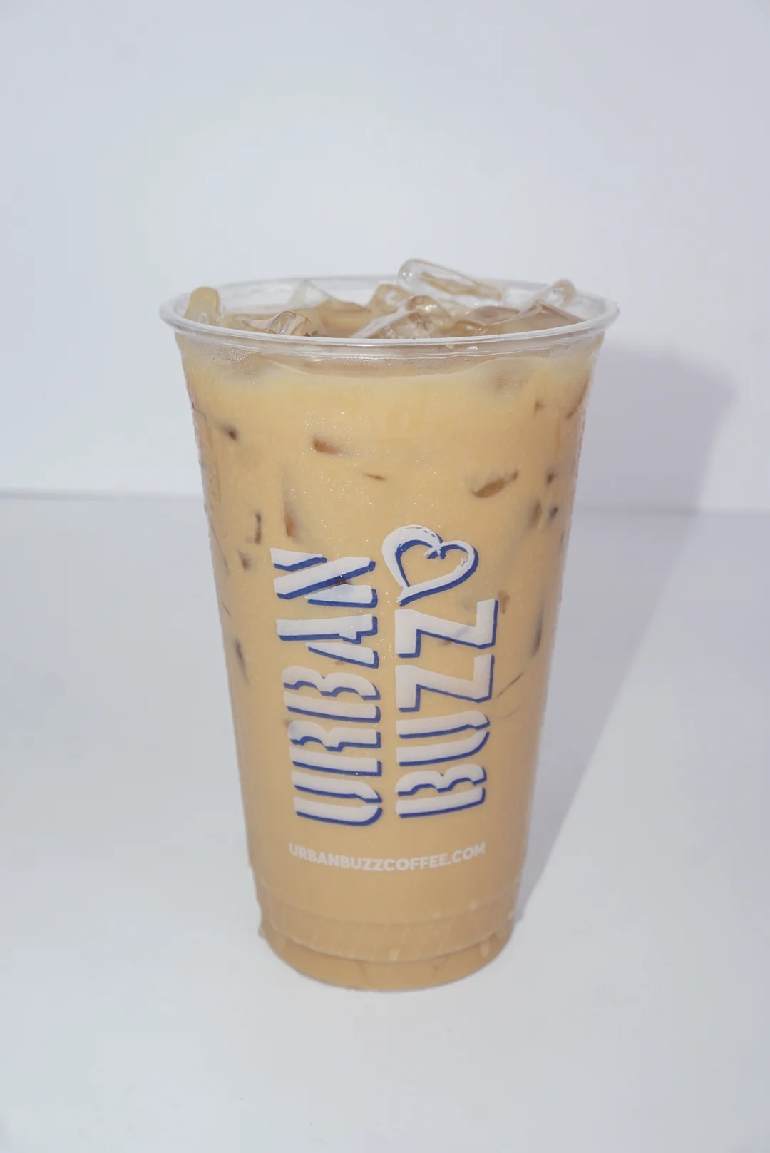 Refreshing iced tea in a clear cup from Urban Buzz Coffee