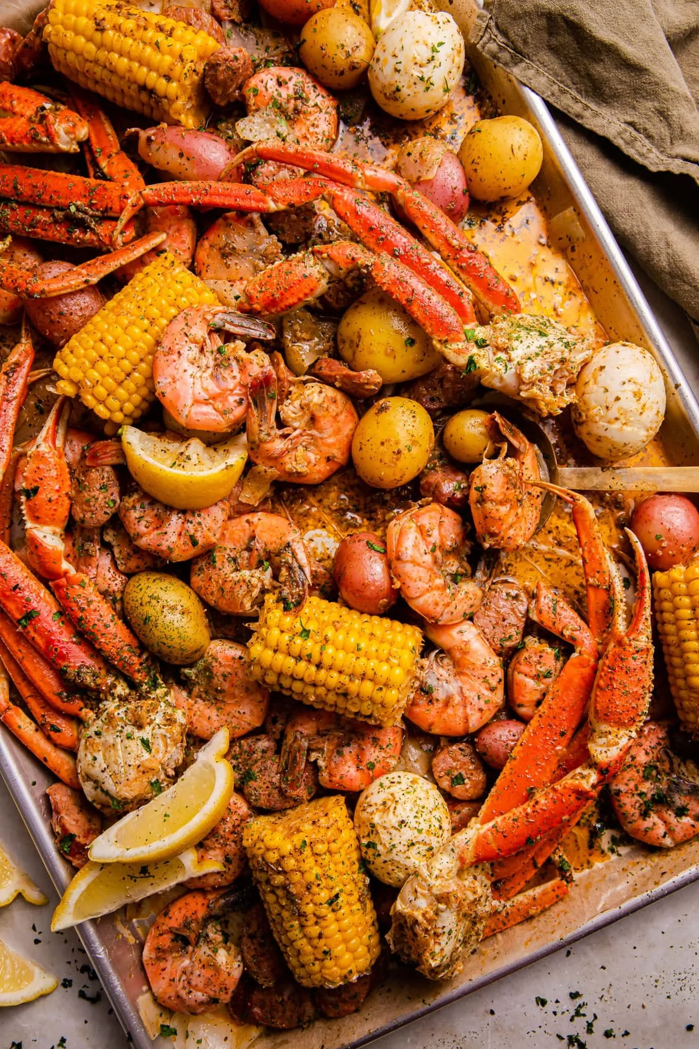 Seafood boil platter with crab, shrimp, and corn