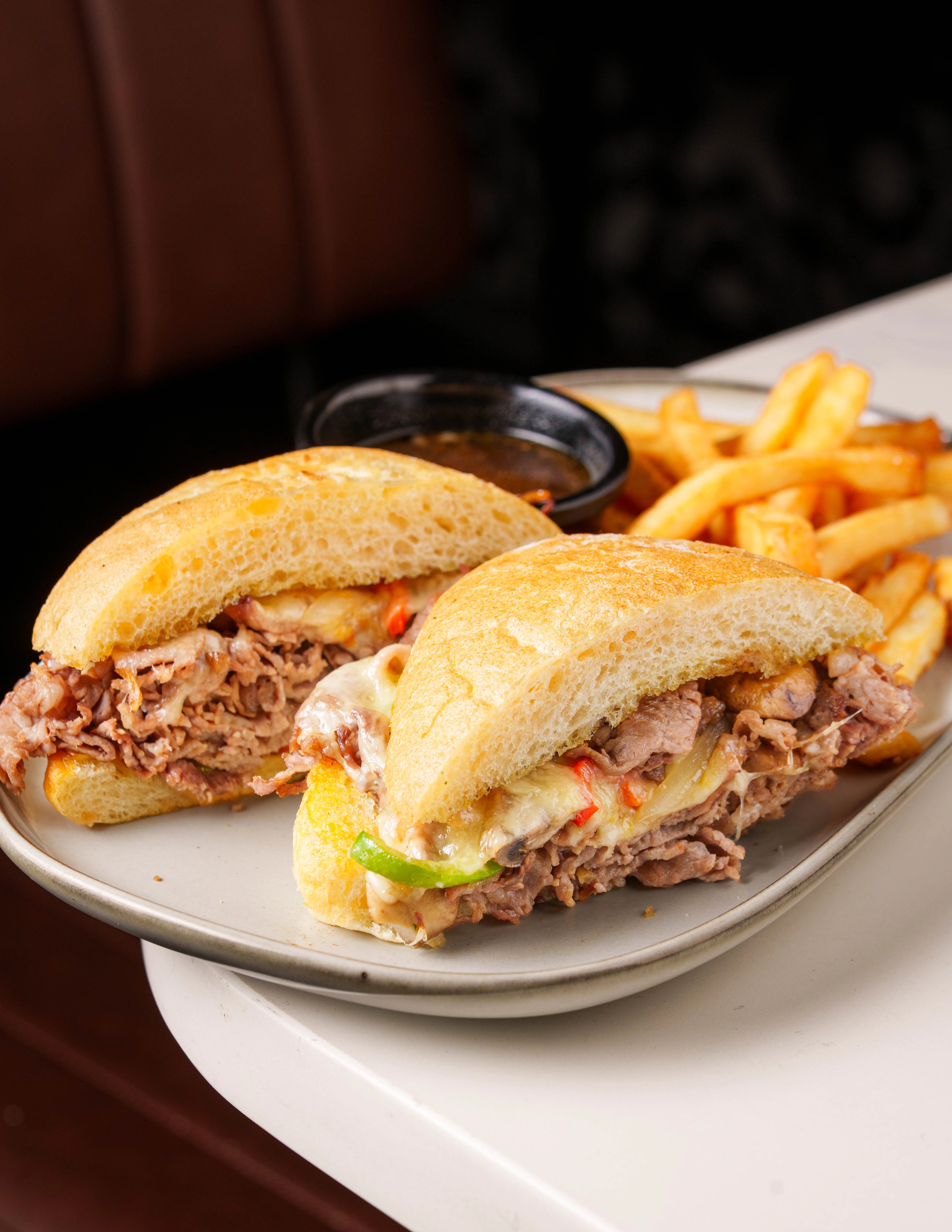 Italian beef sandwich with melted cheese and peppers