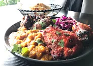 Indian tandoori platter with chicken and lentils