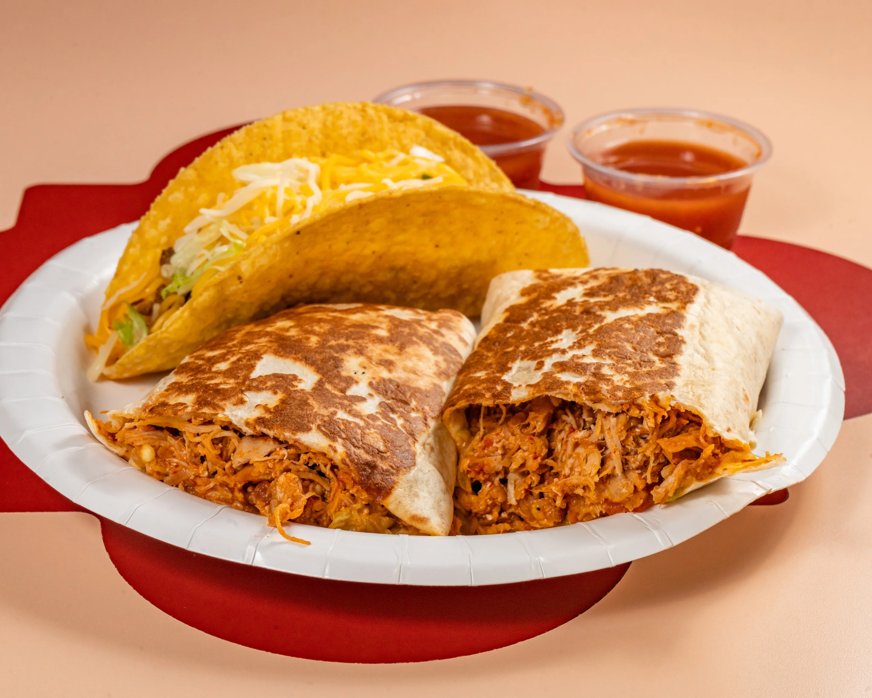 A plate of burritos with a taco