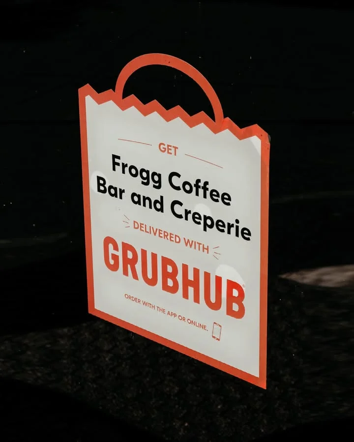 Sign for Frogg Coffee Bar and Creperie with Grubhub delivery