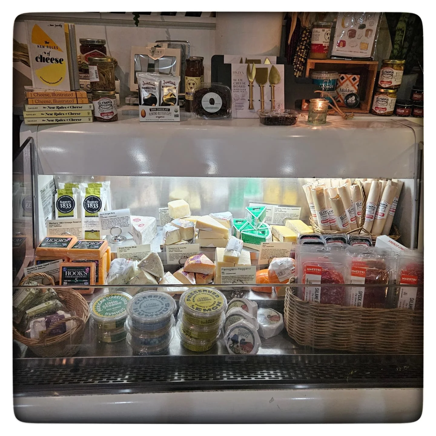 Artisan cheese selection in a gourmet shop display