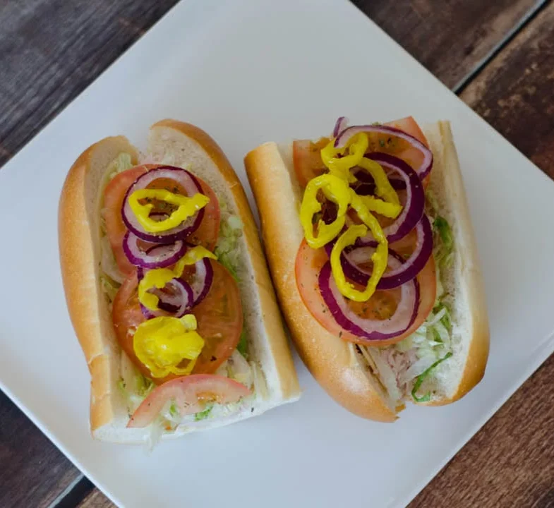 Classic American hot dogs topped with fresh vegetables