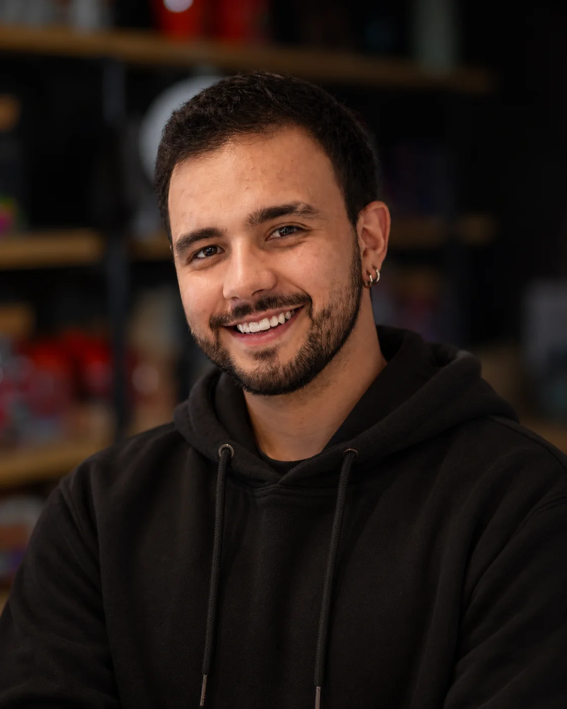Smiling restaurant team member portrait in a modern dining space