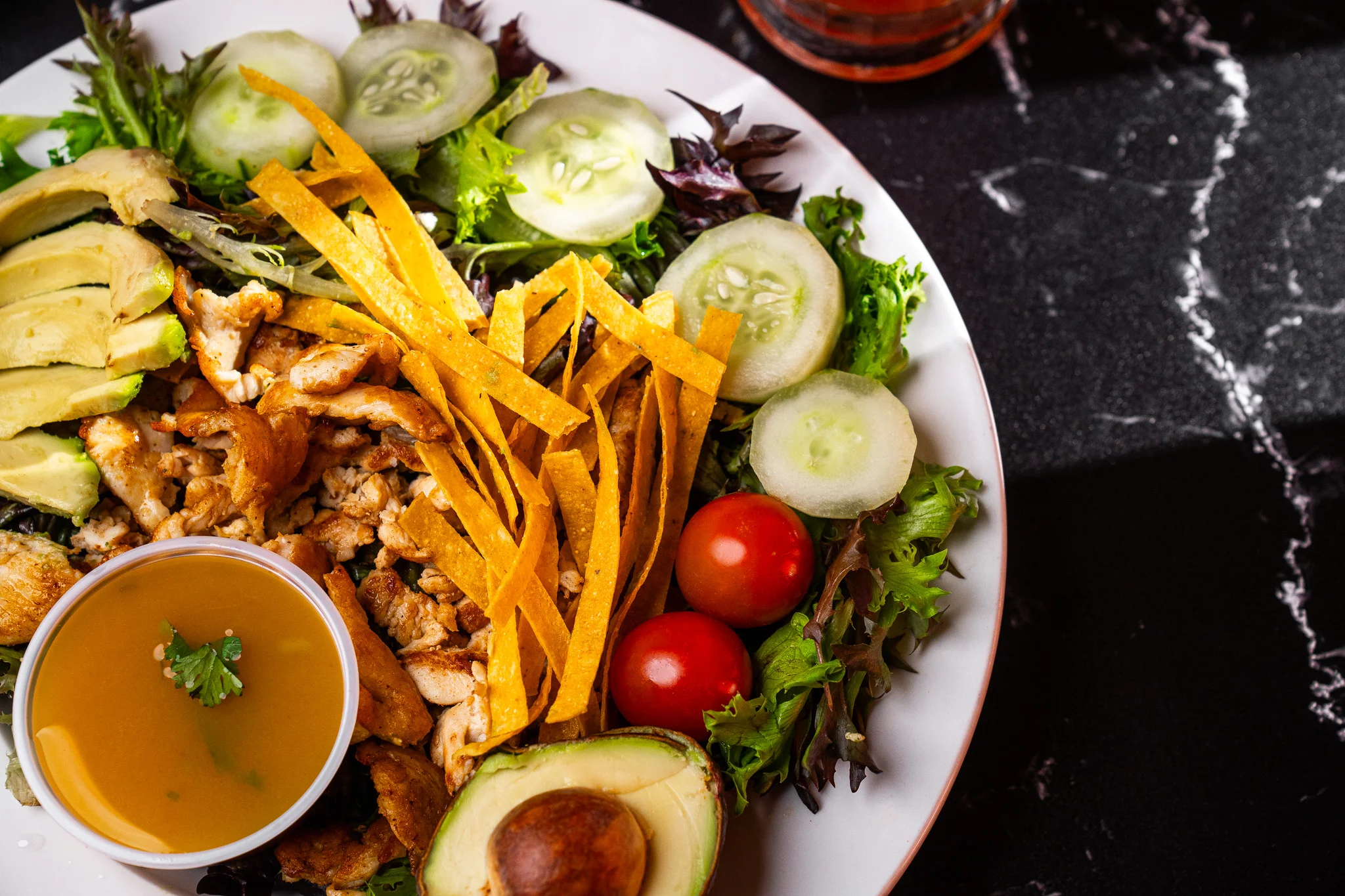 Fresh Mexican chicken salad with avocado and tortilla strips