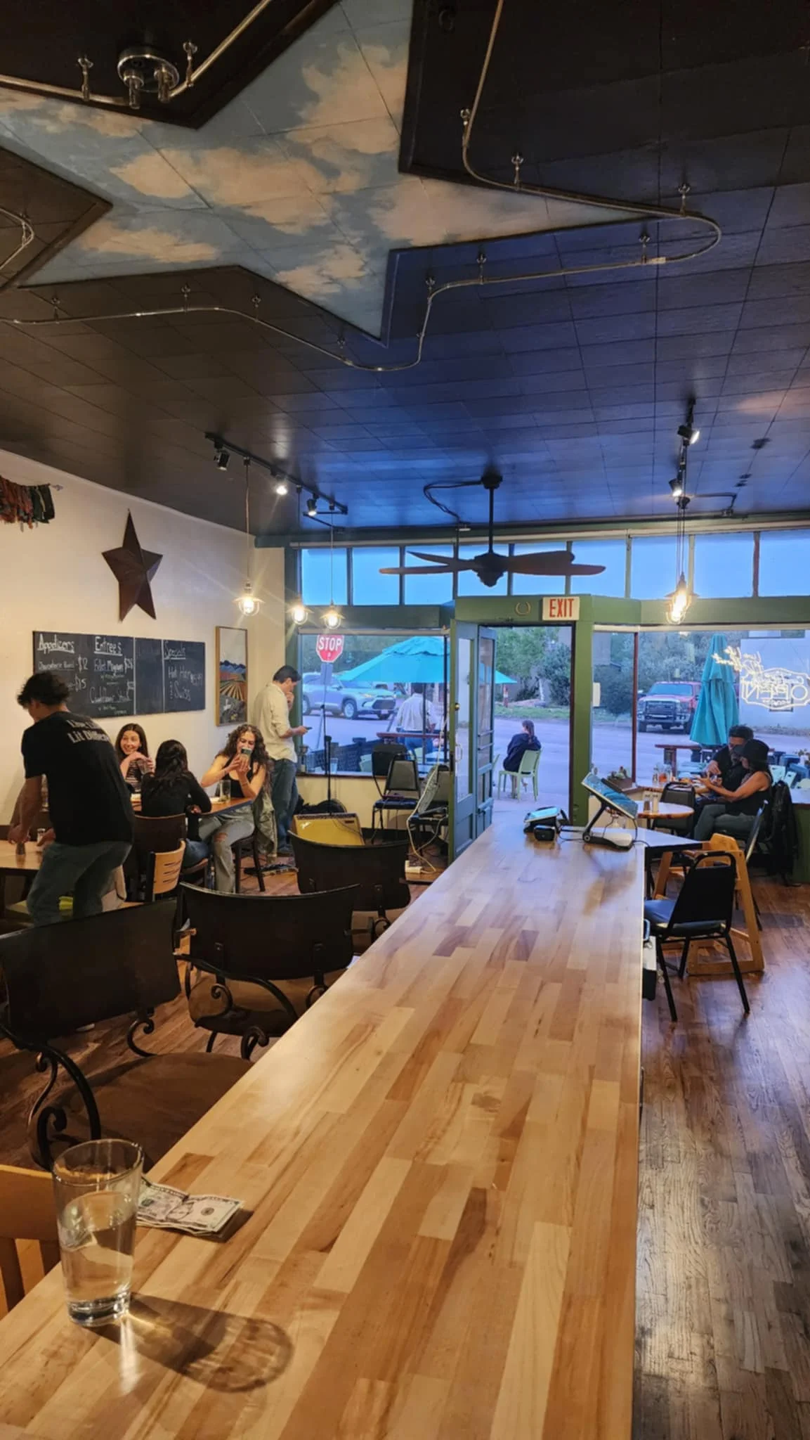 Cozy restaurant interior with wooden bar and warm lighting