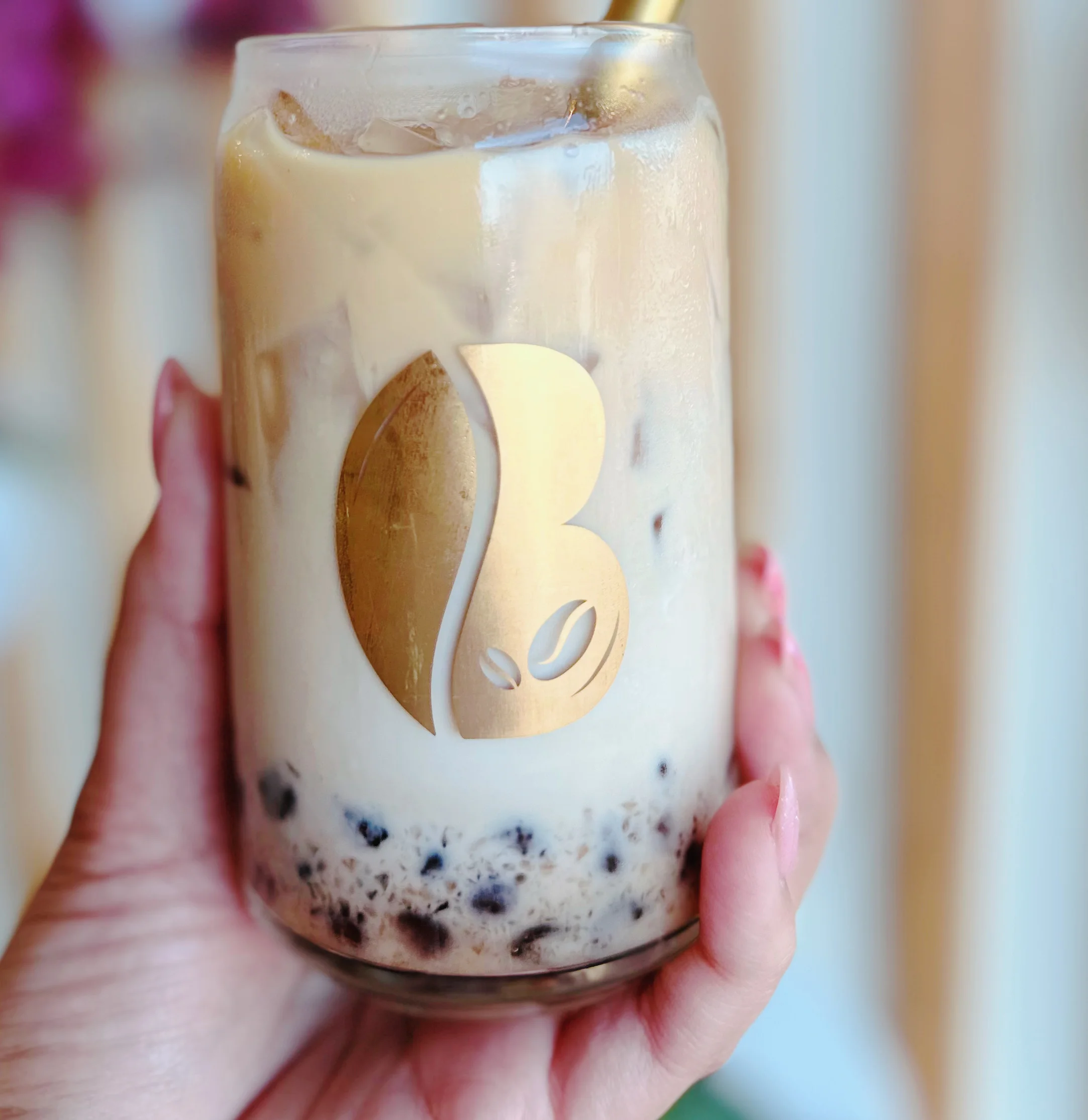 B-Side Coffee Bar’s Iced Honey Bourbon Latte, a refreshing coffee drink with a blend of honey and bourbon flavors, served over ice in Huber Heights, Ohio.