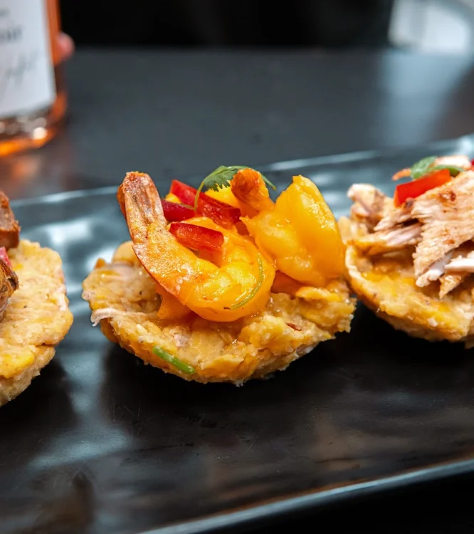 Delicious Puerto Rican tostones topped with shrimp and chicken