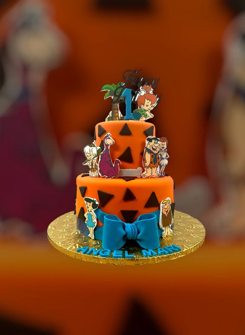 Colorful Halloween-themed cake with cartoon decorations