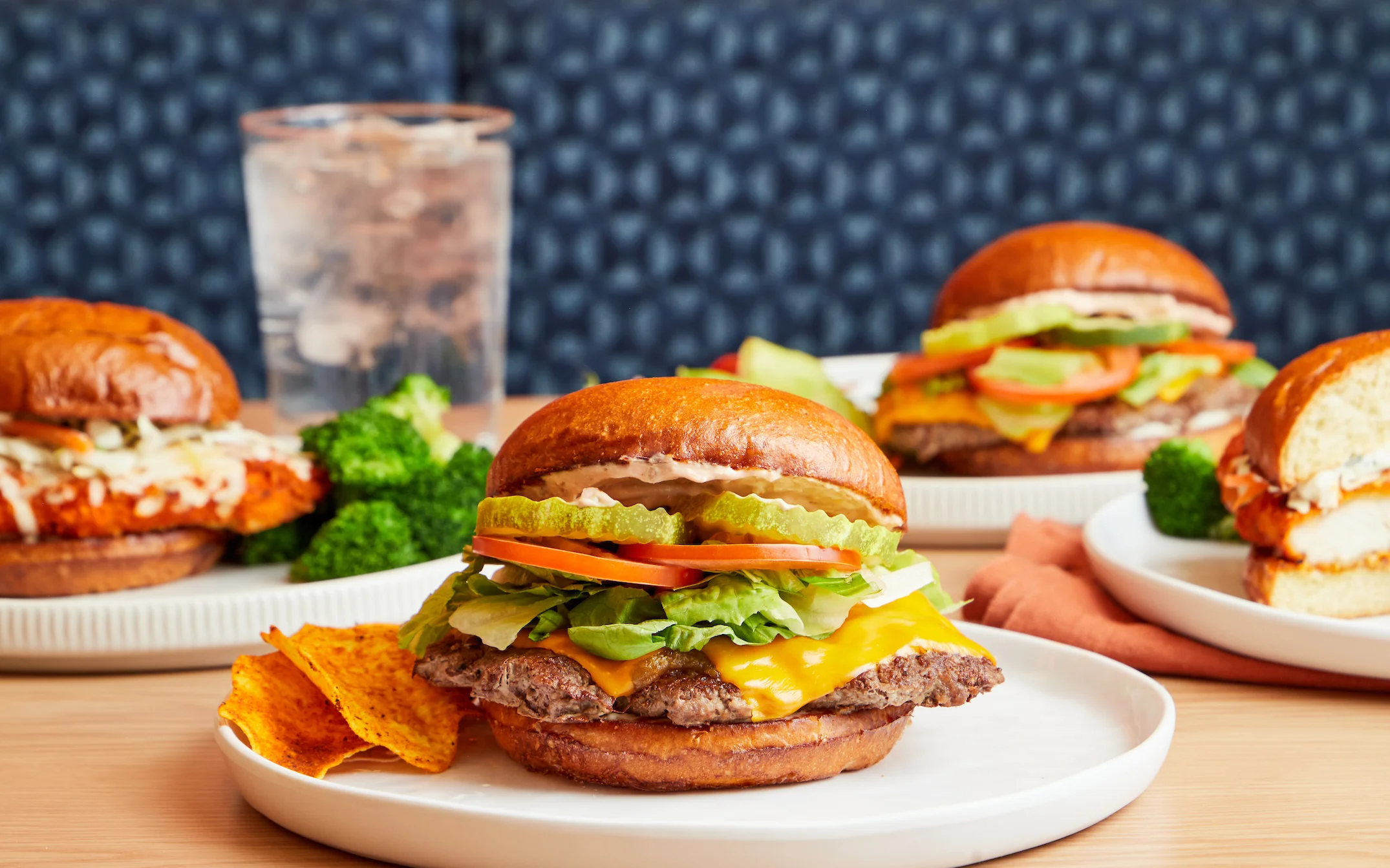 Group shot of burgers and buffalo chicken sandwiches