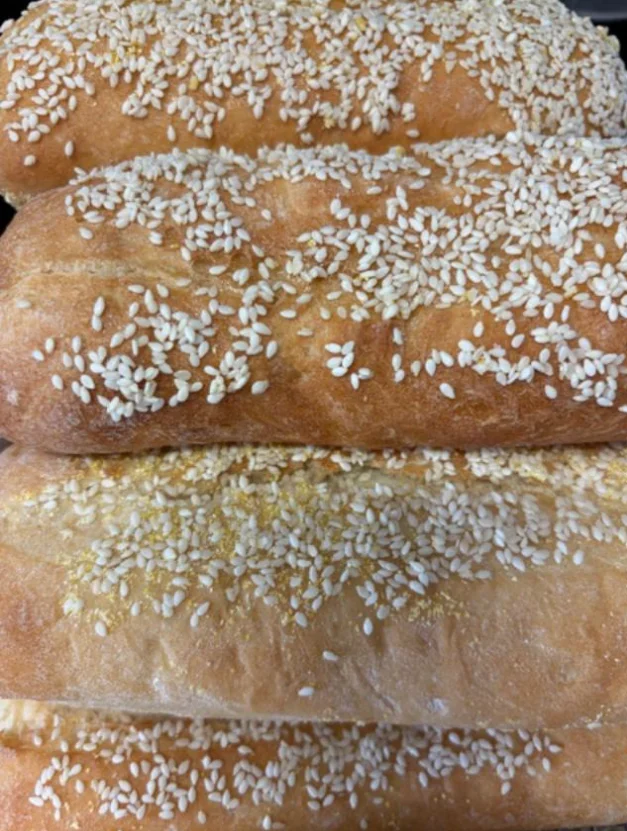 Freshly baked sesame bread loaves