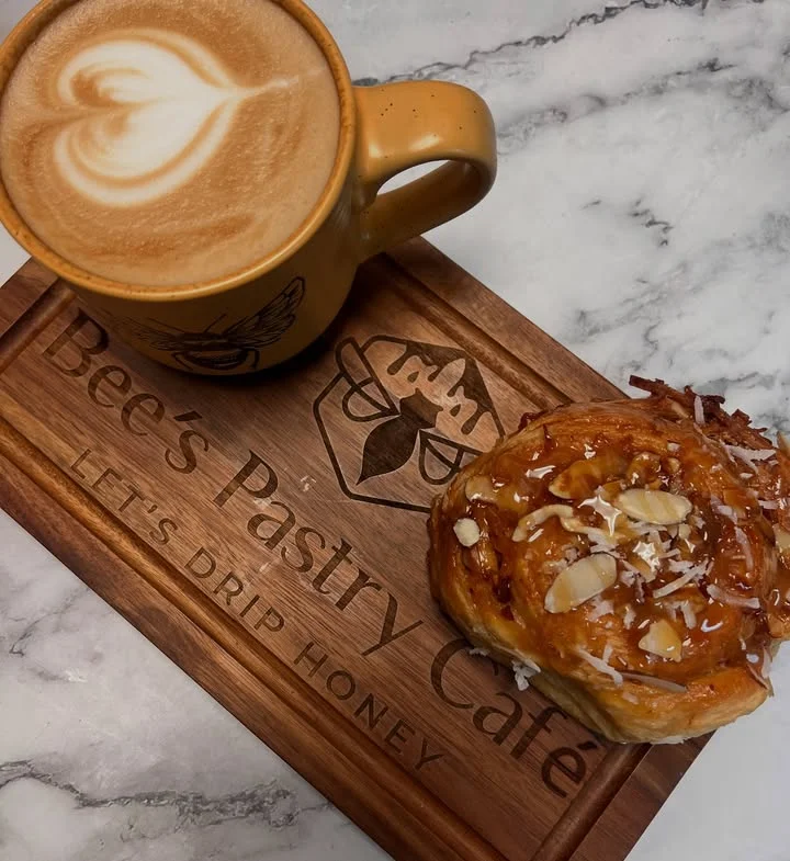 Freshly baked almond croissant at a cozy café