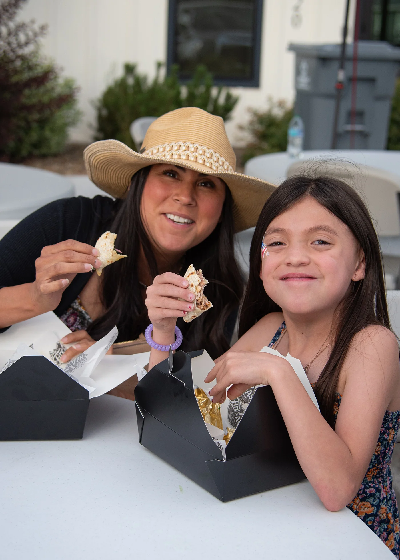 Enjoying tacos at a casual outdoor dining setting