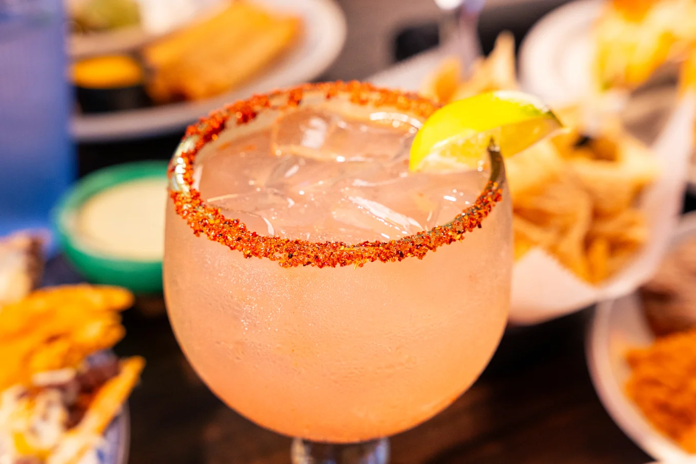 Refreshing margarita cocktail with a spicy rim and lime garnish