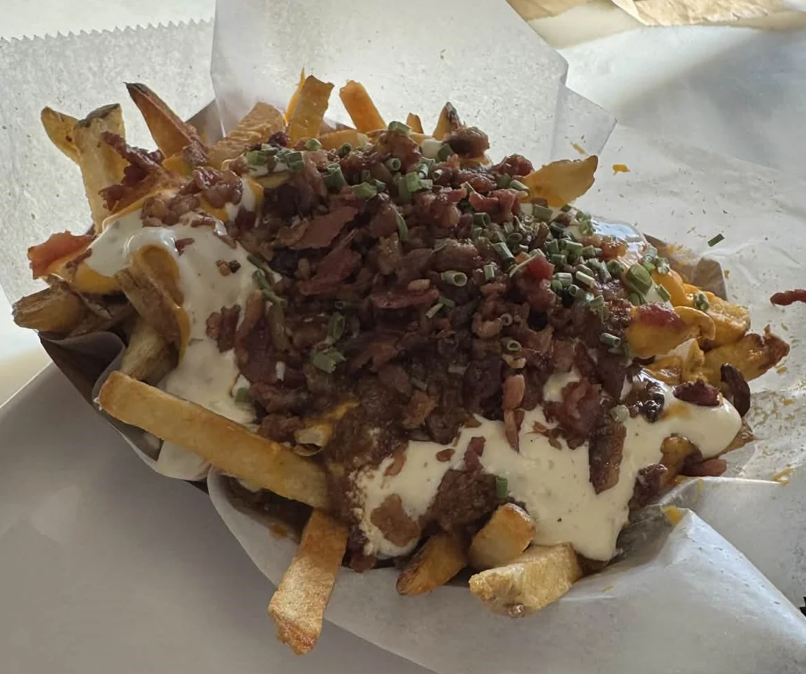Loaded Canadian poutine with bacon and cheese