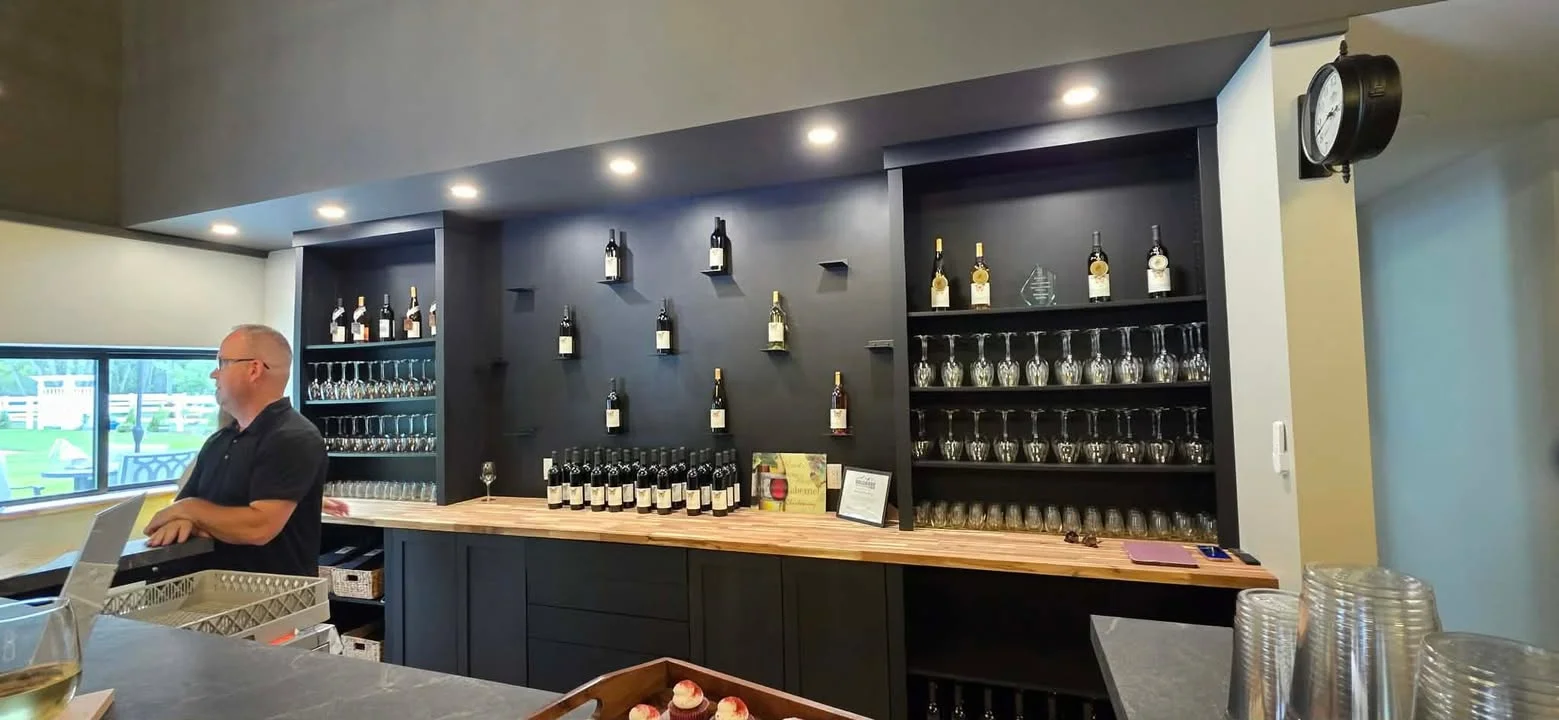 Modern bar counter with wine bottles and glasses
