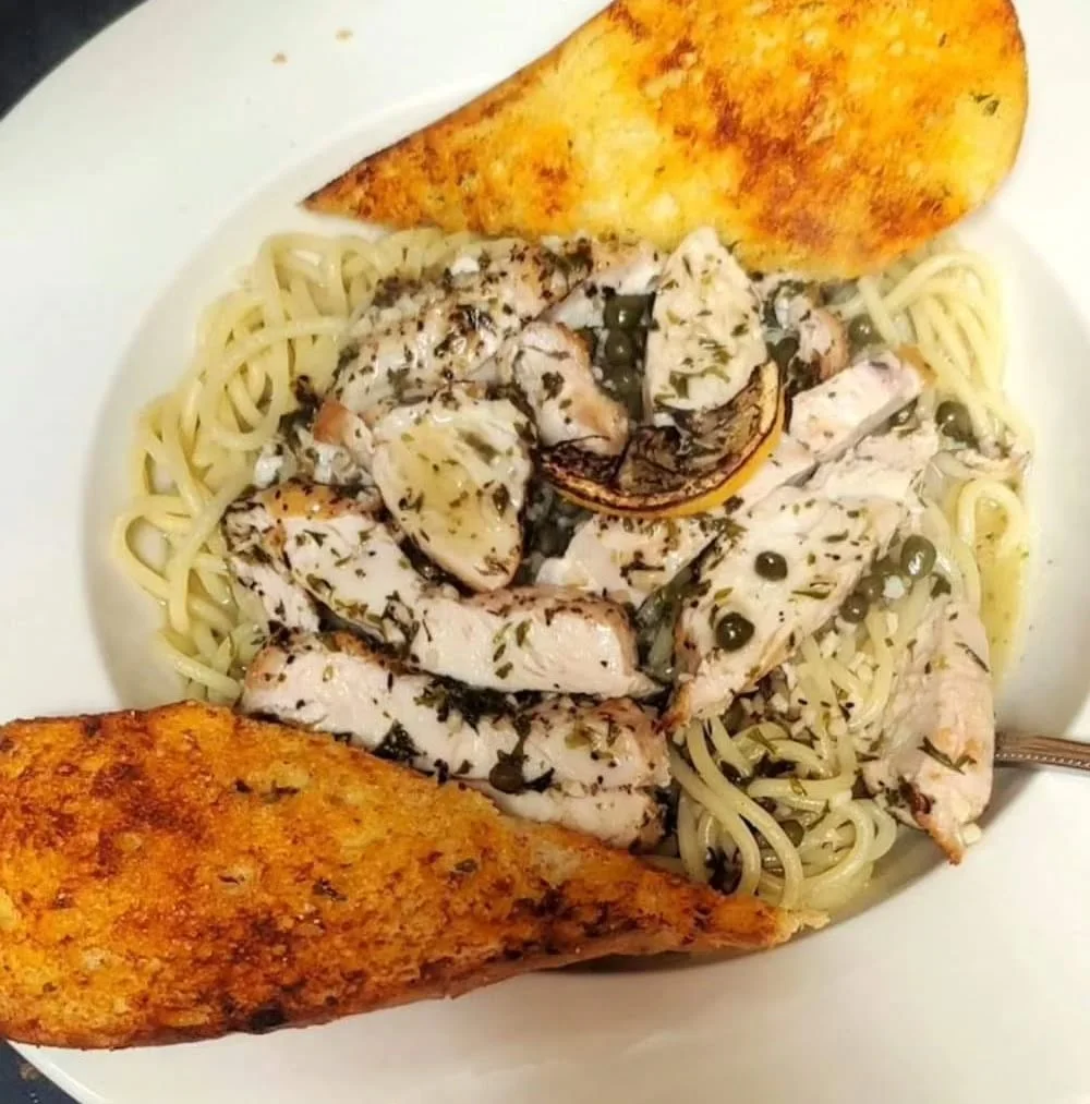 Creamy chicken piccata pasta with garlic bread