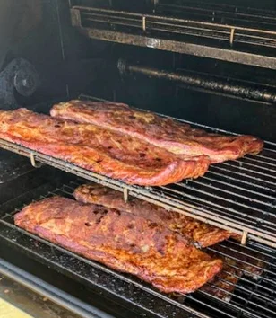 Smoked barbecue ribs in a smoker