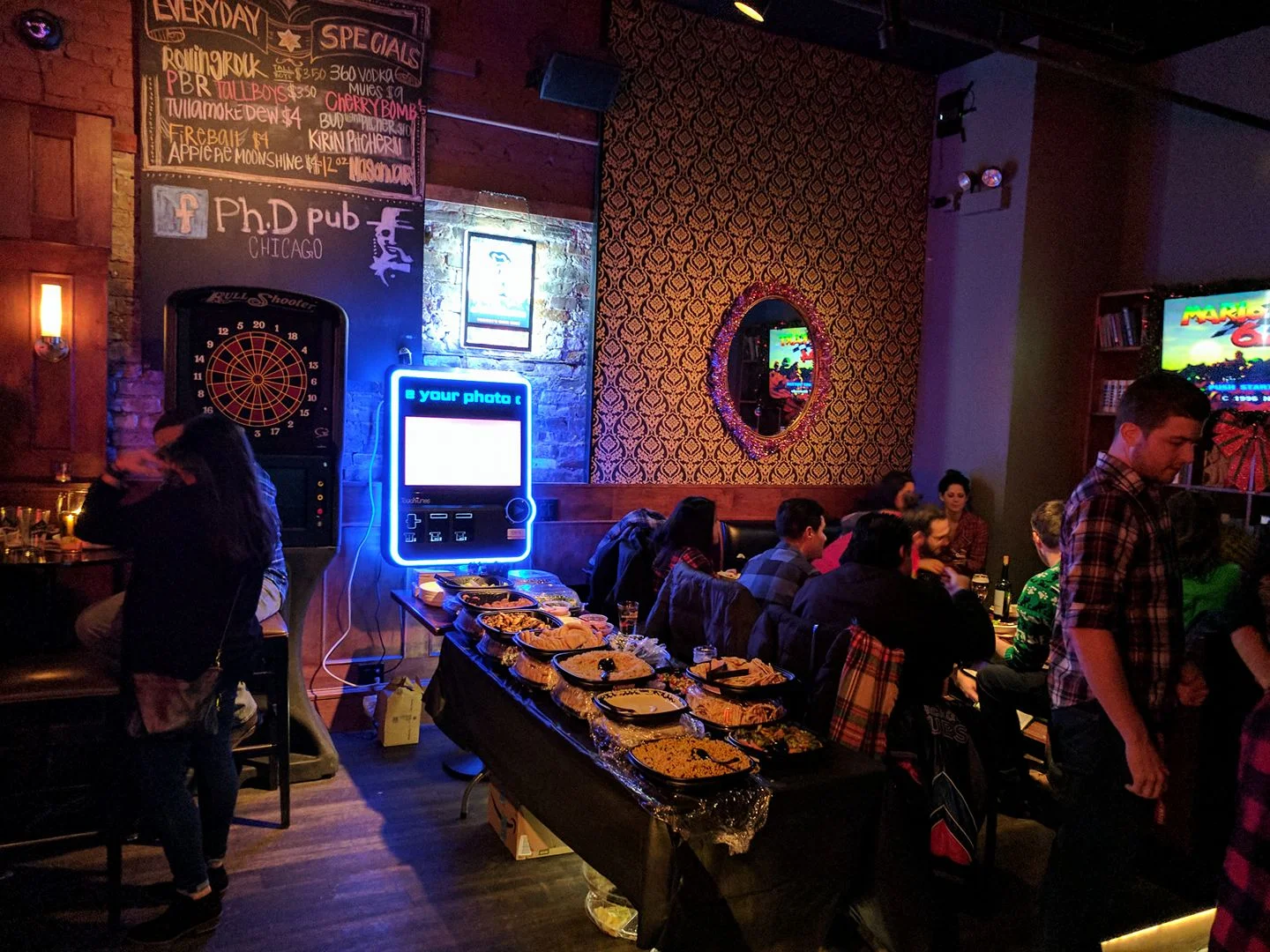 Cozy pub interior with dartboard and food spread