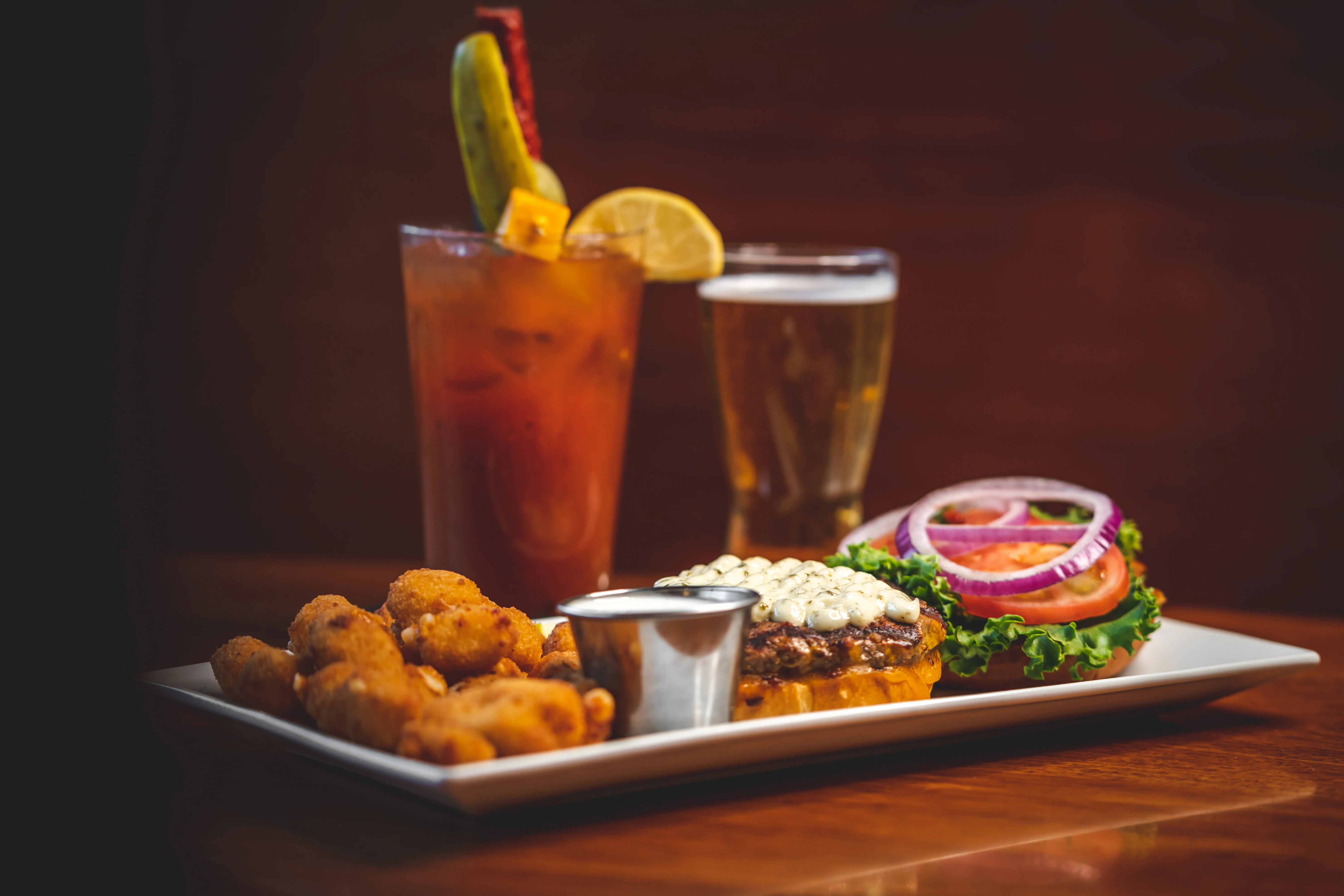 Delicious gourmet burger with fresh toppings on a wooden table