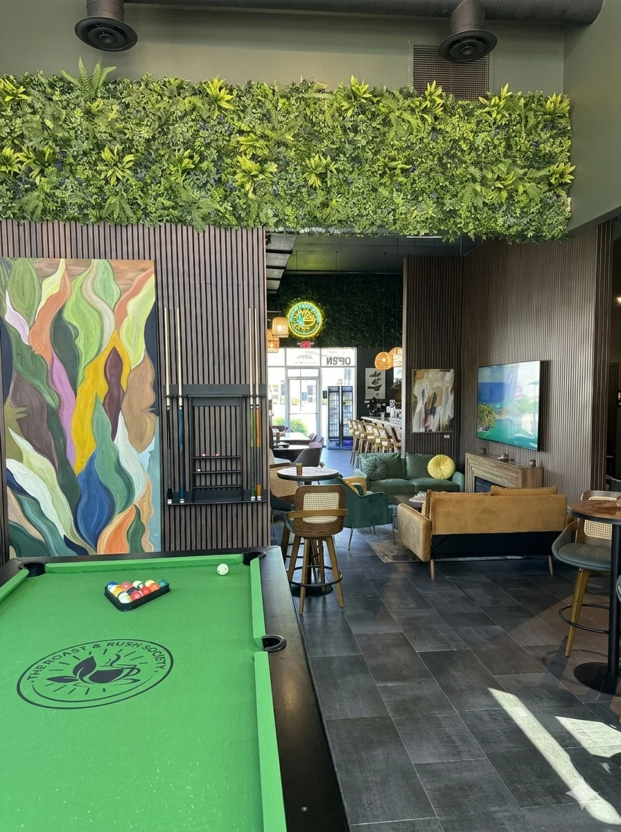 Stylish restaurant interior with greenery and pool table