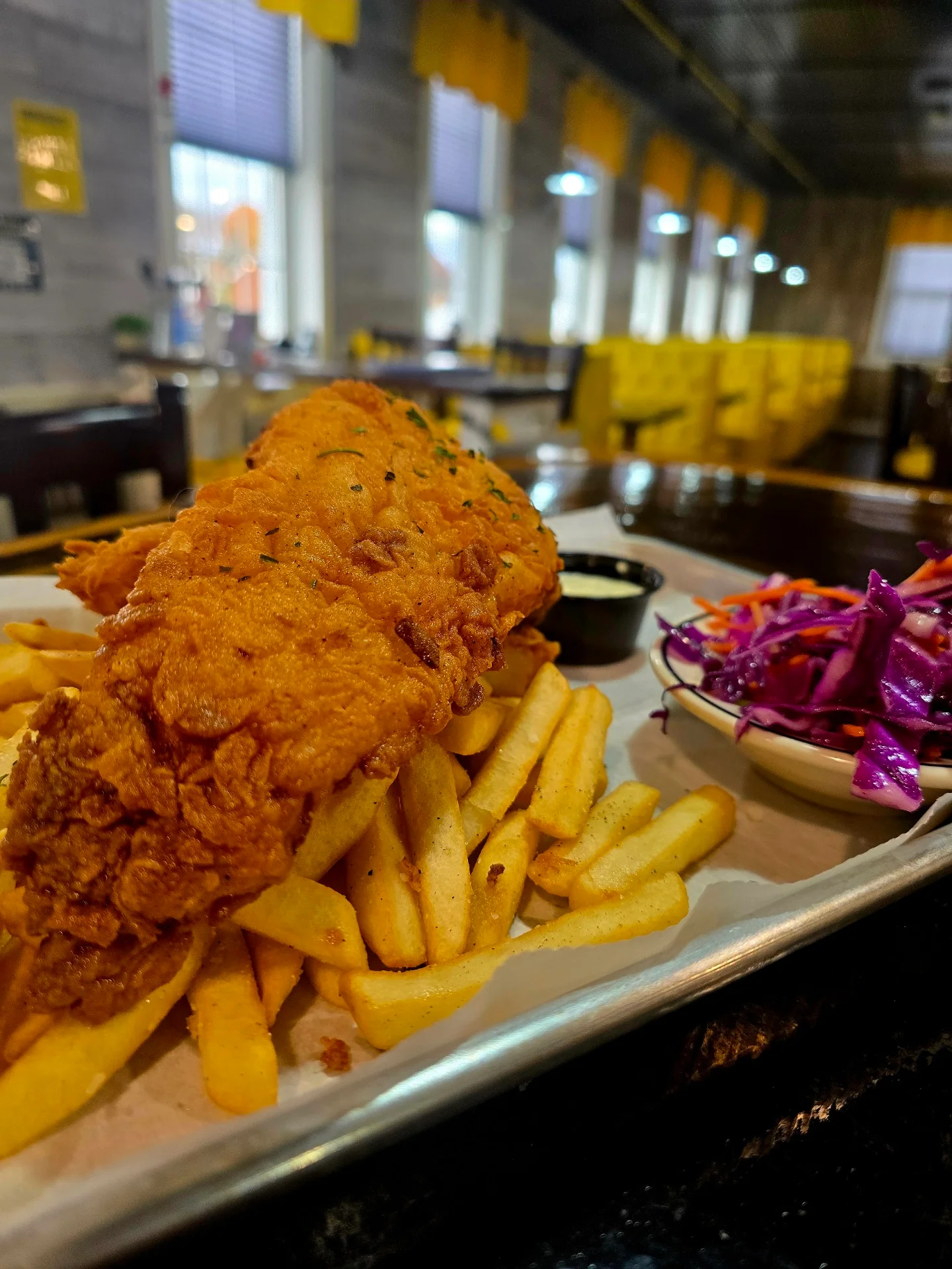 Crispy fried fish and chips with coleslaw