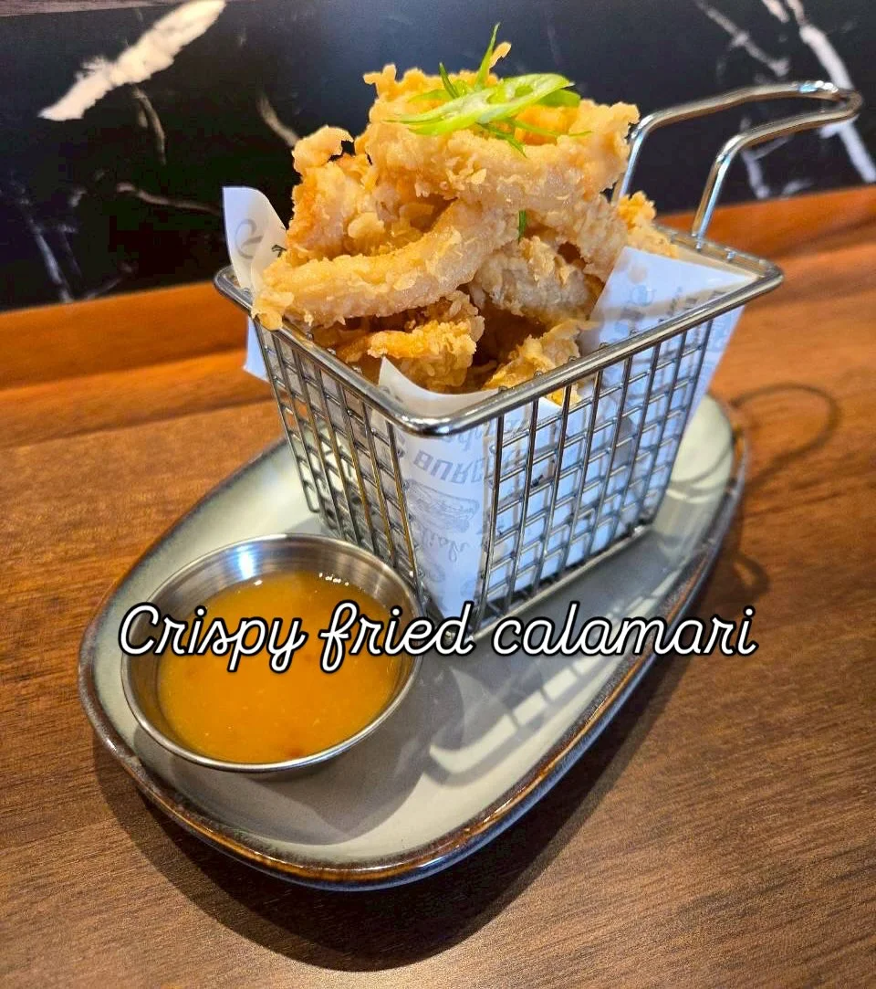 Crispy fried calamari served with dipping sauce