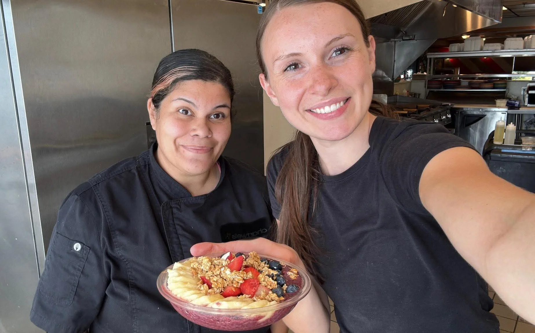 Colorful acai bowl topped with fresh fruits and granola