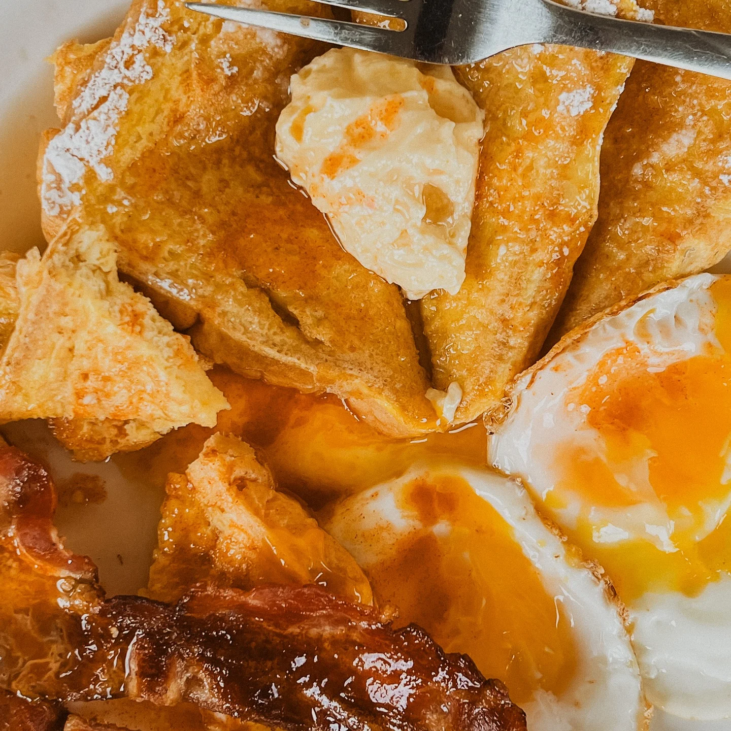 Classic American breakfast with French toast and eggs