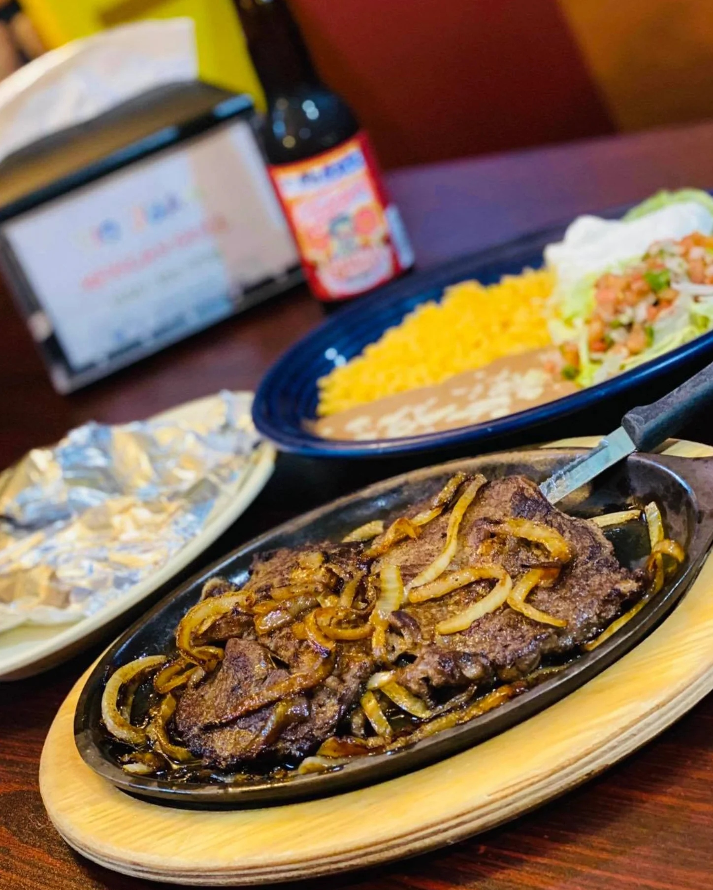 Sizzling fajitas with grilled beef and onions