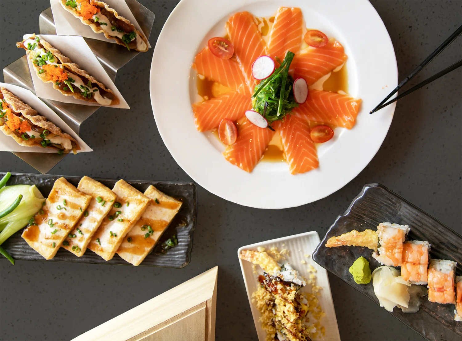  A photo of salmon sashimi, tofu and our tuna in crispy wonton