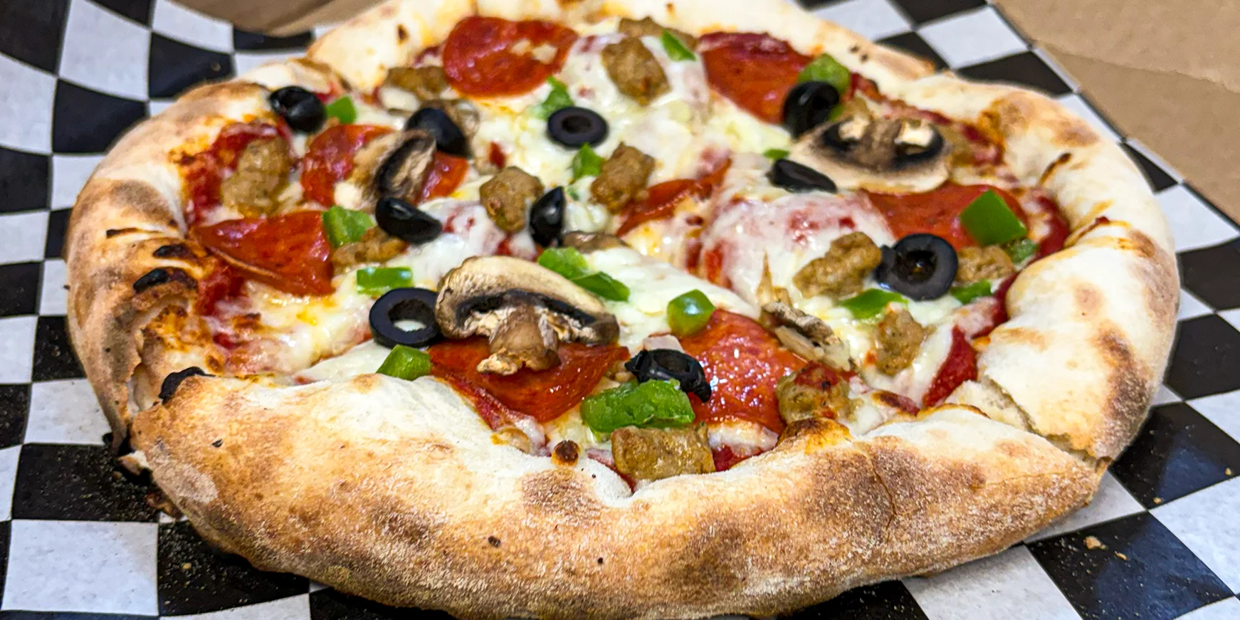 Pepperoni pizza with jalapeños and melted cheese