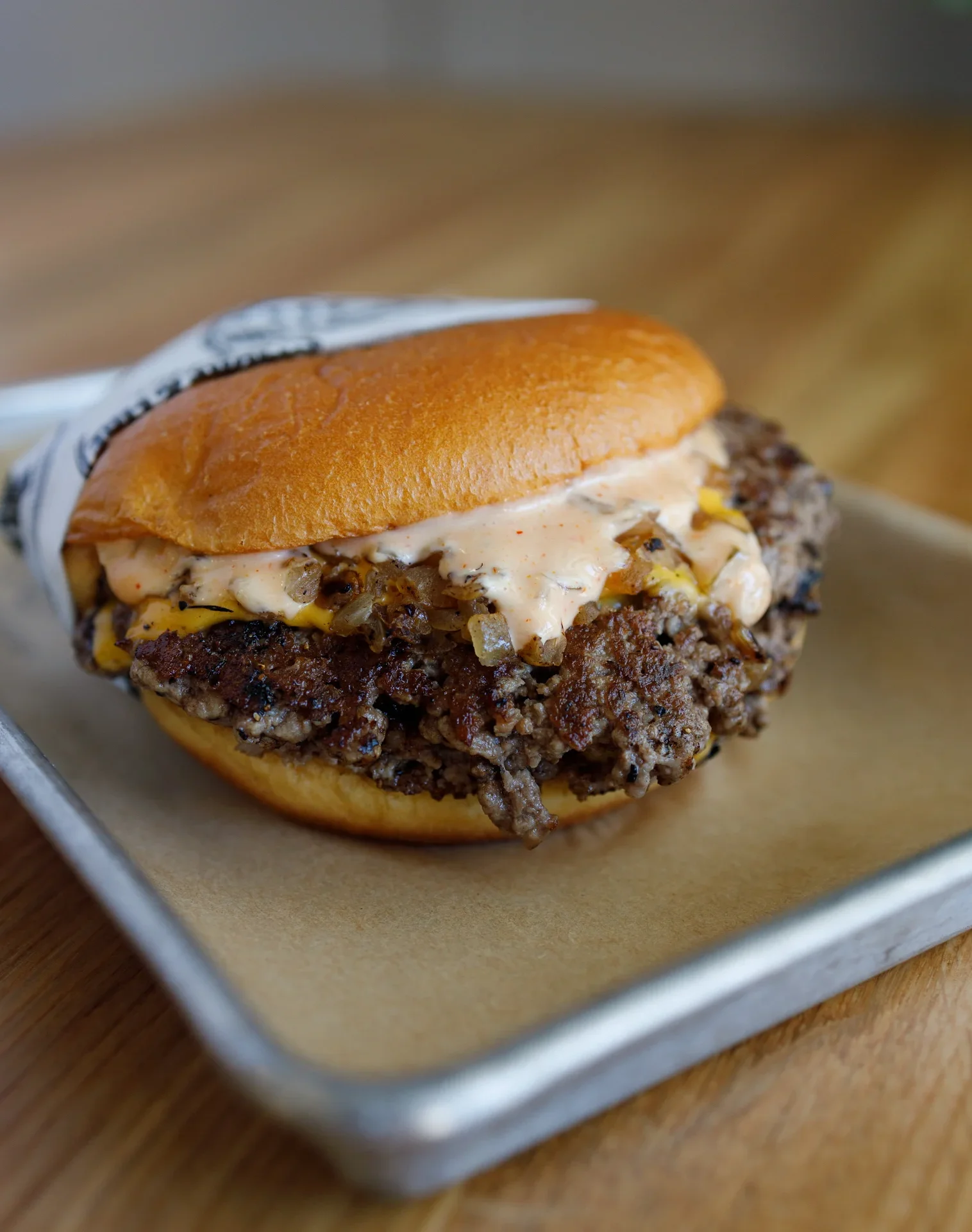 Juicy cheeseburger with special sauce and grilled onions