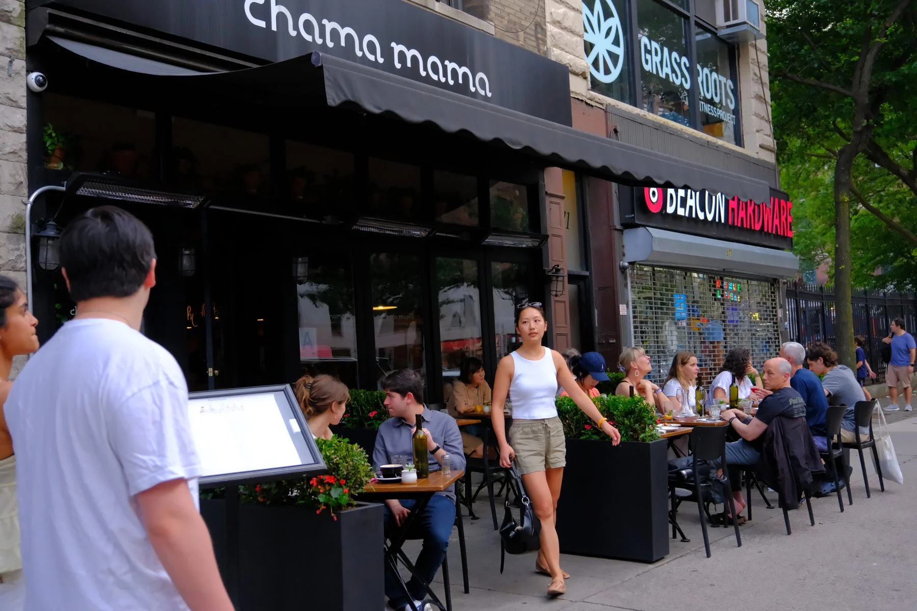 Guests at the sidewalk tables outside Chama Mama Upper West Side