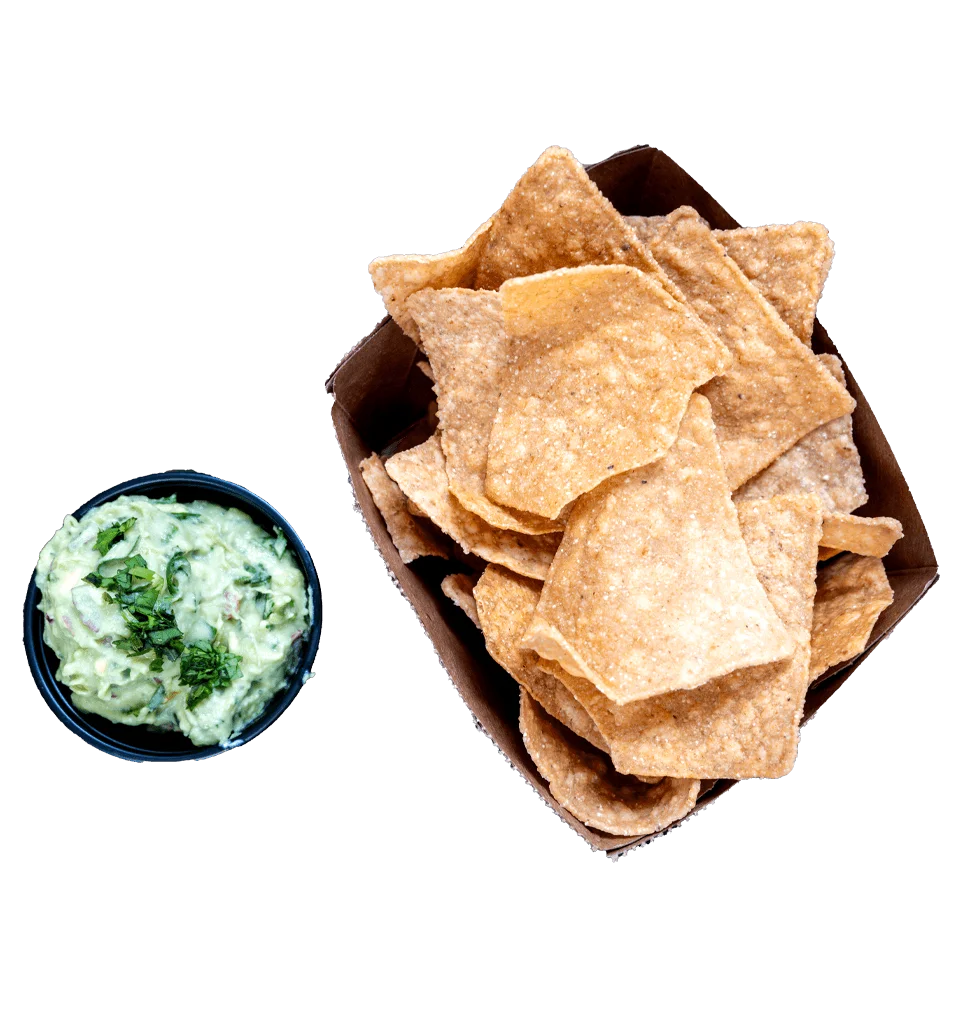 Crispy tortilla chips with guacamole dip