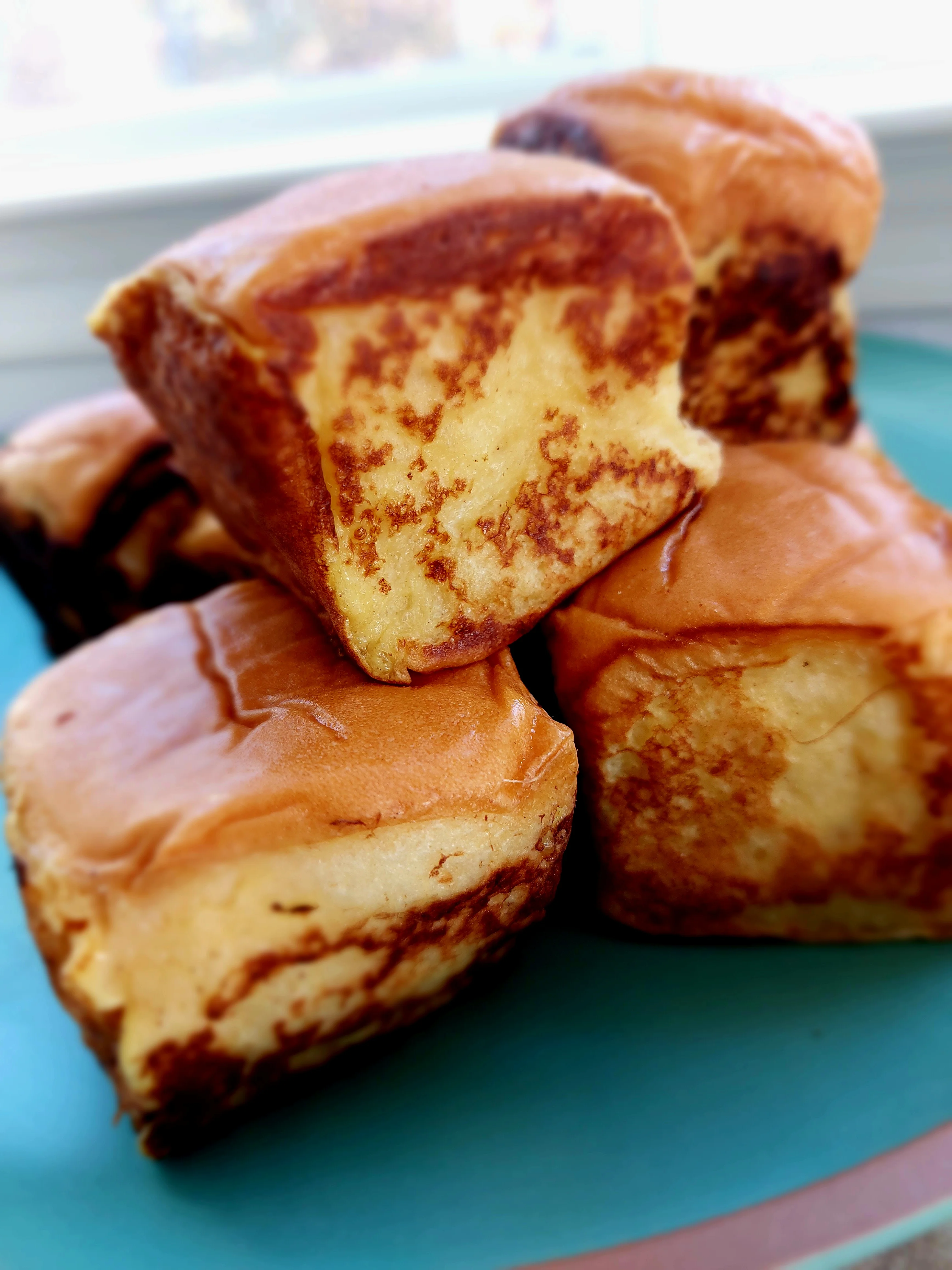 Delicious Japanese milk bread rolls stacked on a plate