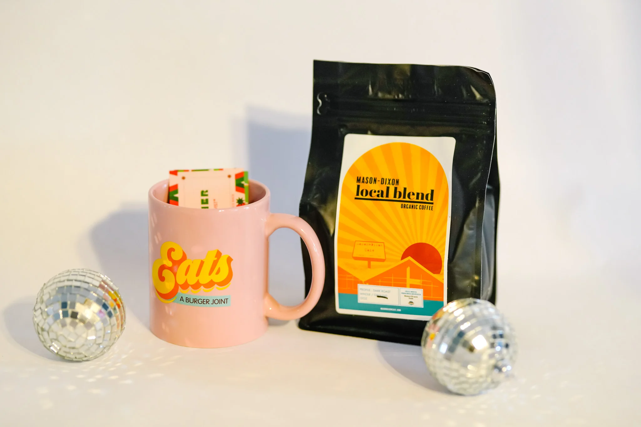 Coffee and mug from a burger joint with disco ball decor