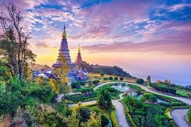 Scenic view of pagodas at sunrise in a lush garden