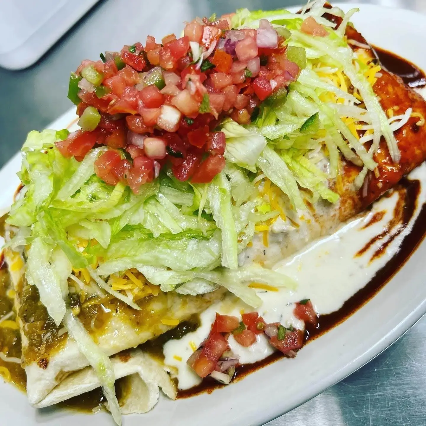 A New Mexican style breakfast burrito with red and green Chile from Doozy's Diner, a breakfast brunch restaurant in Catonsville,MD