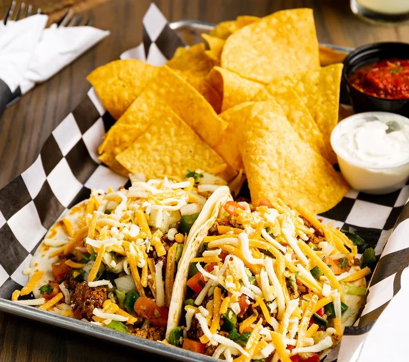 Delicious Mexican tacos with tortilla chips and salsa
