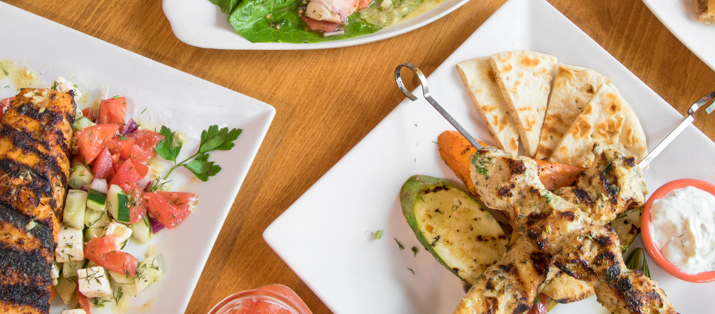 Mixed grill platter featuring kebabs and shrimp