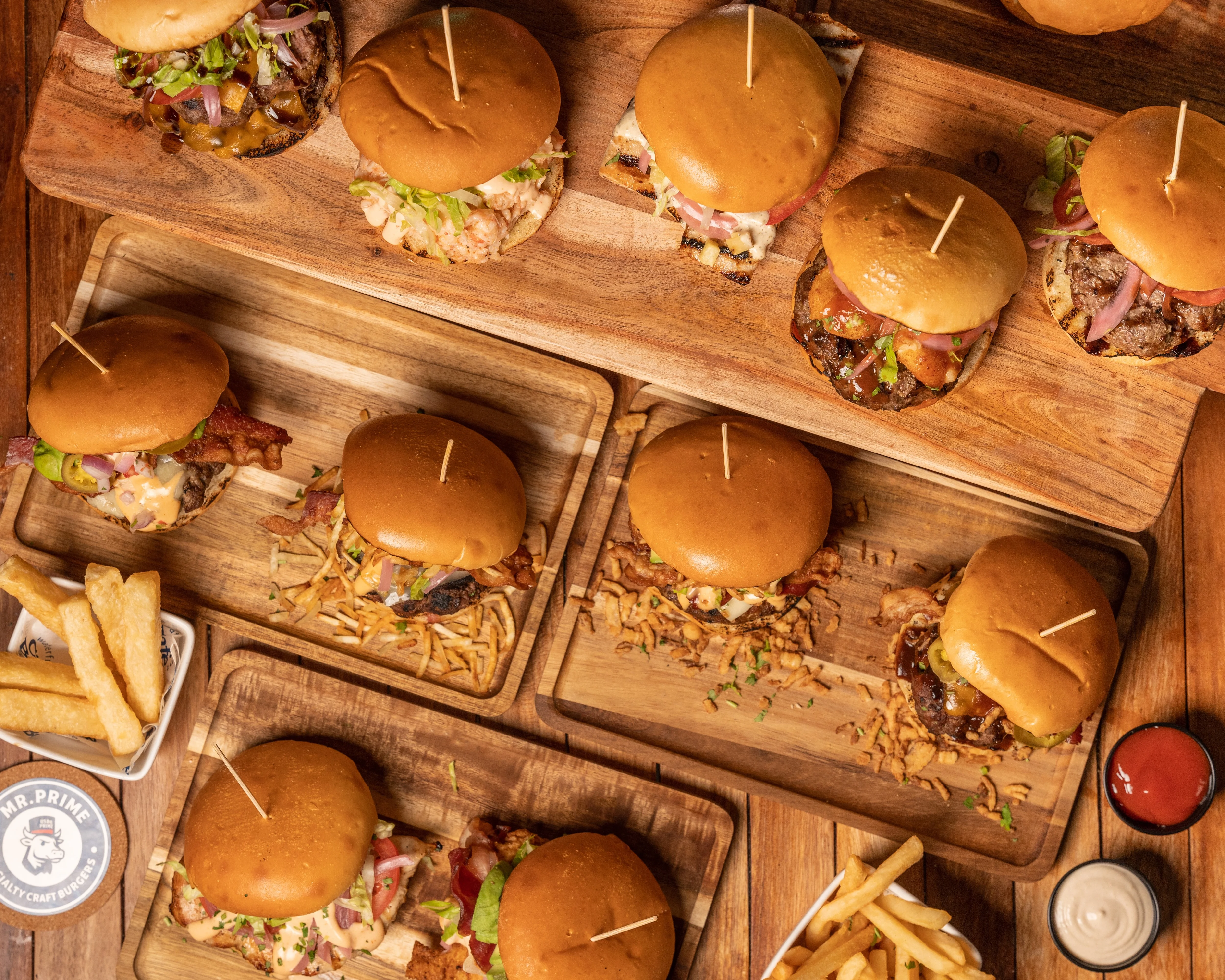 Delicious gourmet burger with toppings on a wooden table